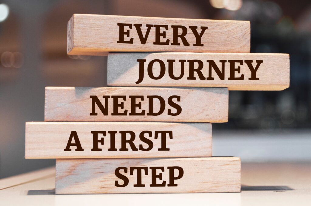Image: Blocks with the words "Every Journey Needs a First Step"